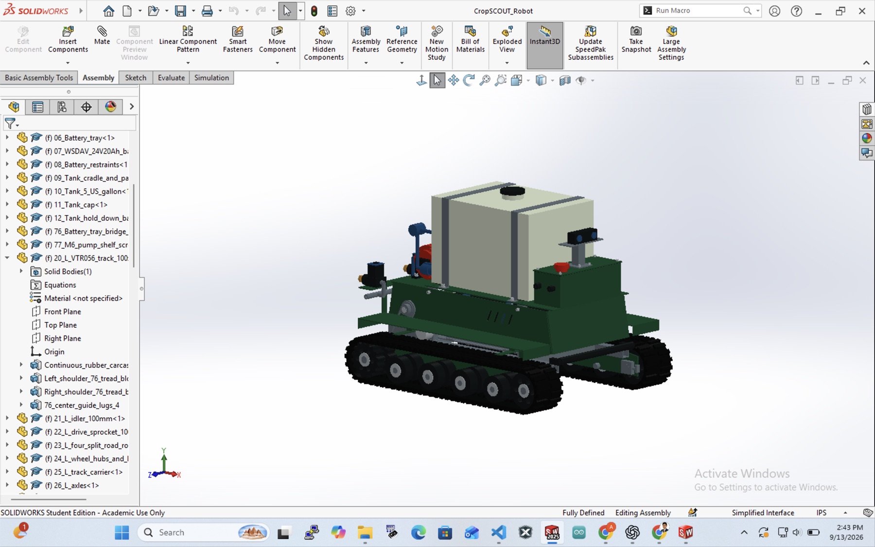 SolidWorks assembly of CropSCOUT_Robot showing the feature tree: battery tray, 24V 20Ah battery, tank, track, idlers, sprockets, road rollers